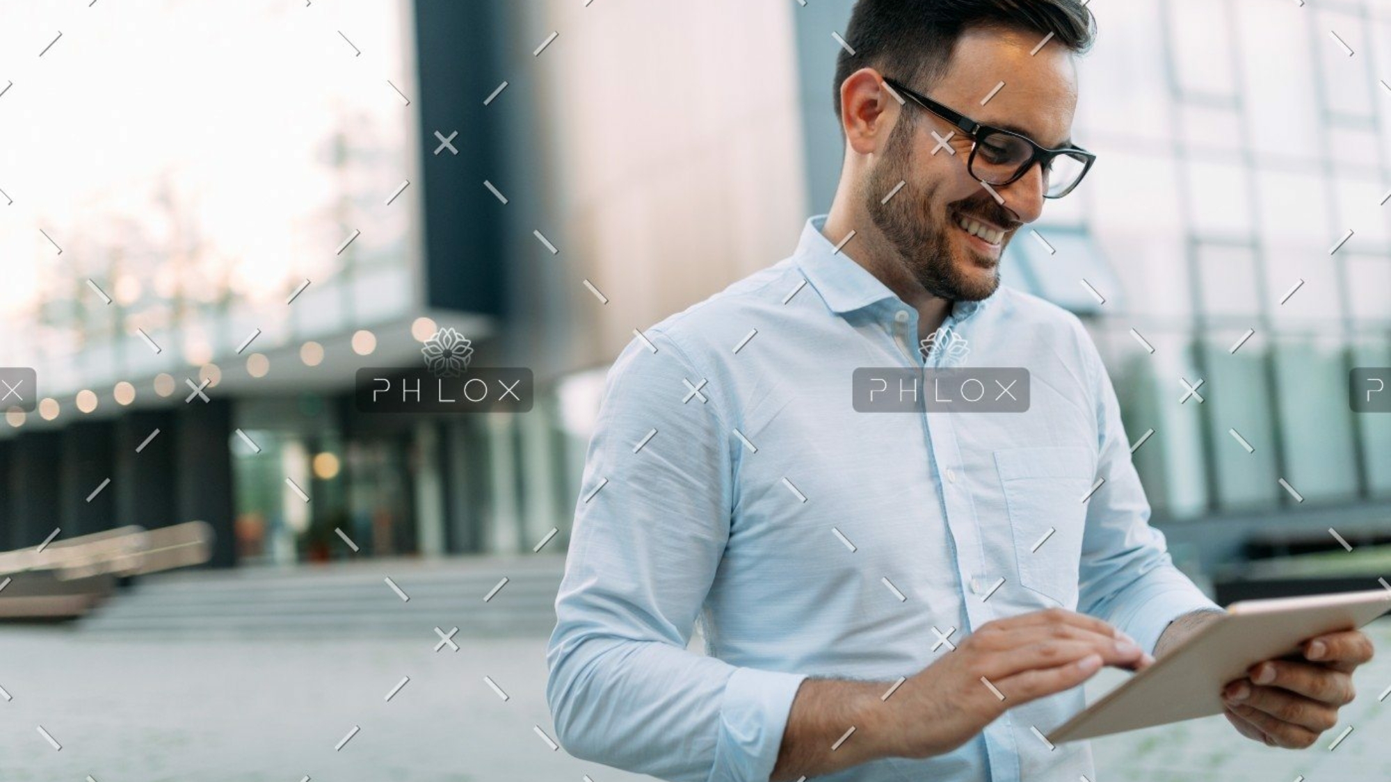 demo-attachment-448-portrait-of-businessman-in-glasses-holding-tablet-AWVHCJU